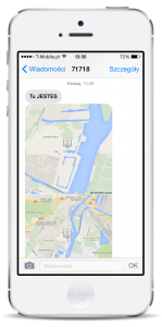 Telefon z mapą w usłudze Gdzie Jest Dziecko, czyli zdjęcie białego telefonu komórkowego na którym widoczna jest mapa jako wiadomość